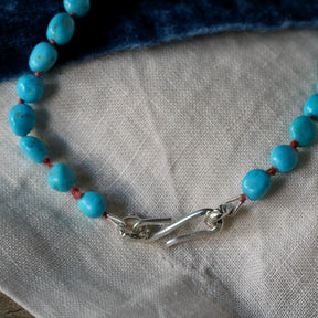 Sleeping Beauty Turquoise Necklace – Hand-Knotted on Coral Pink Silk
