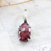 Rose cut Rhodolite Garnet prong set in sterling silver with heart deatail