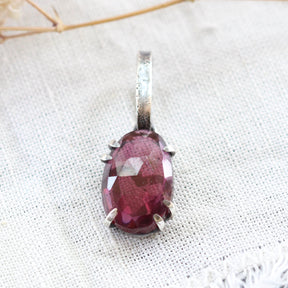 Rose cut Rhodolite Garnet prong set in sterling silver with heart deatail