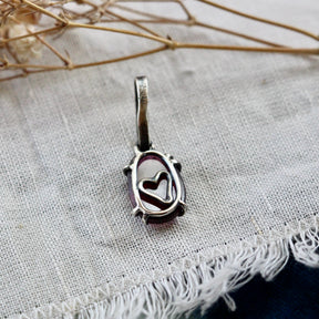 Rose cut Rhodolite Garnet prong set in sterling silver with heart deatail