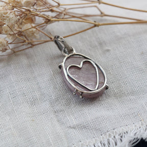 Rose cut Pink Sapphire prong set in sterling silver with heart detail