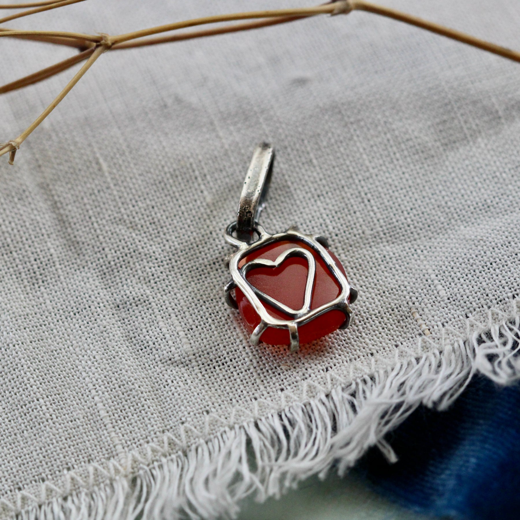 Rose cut Carnelian prong set in sterling silver with heart detail