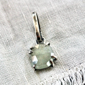 Rose cut green Sapphire prong set in sterling silver with heart detail