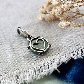 Rose cut Emerald prong set in sterling silver with heart detail