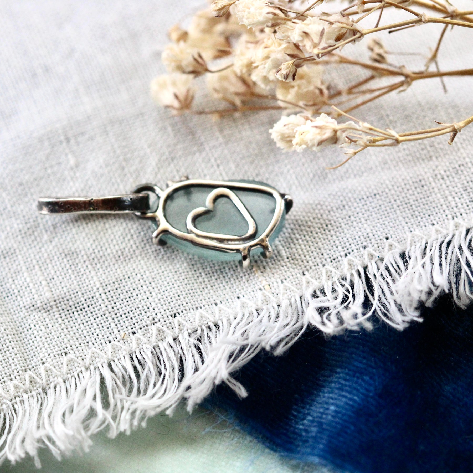 Rose cut Aquamarine prong set in sterling silver with heart detail