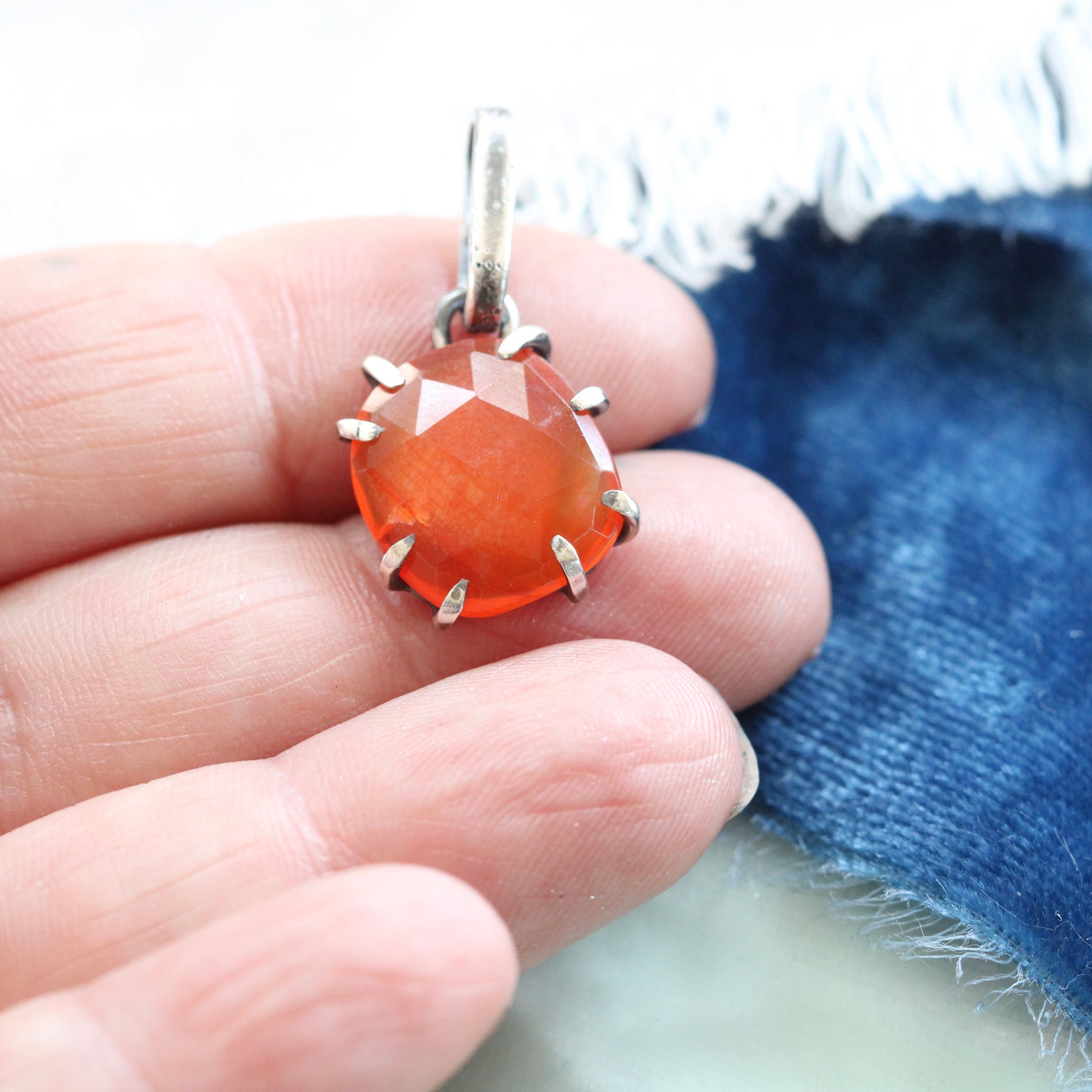 Rose cut Carnelian prong set in sterling silver with heart detail