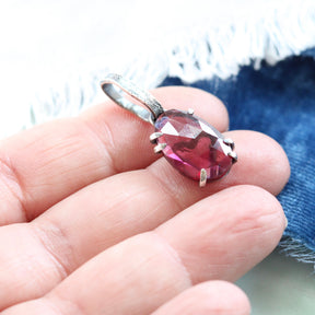 Rose cut Rhodolite Garnet prong set in sterling silver with heart deatail