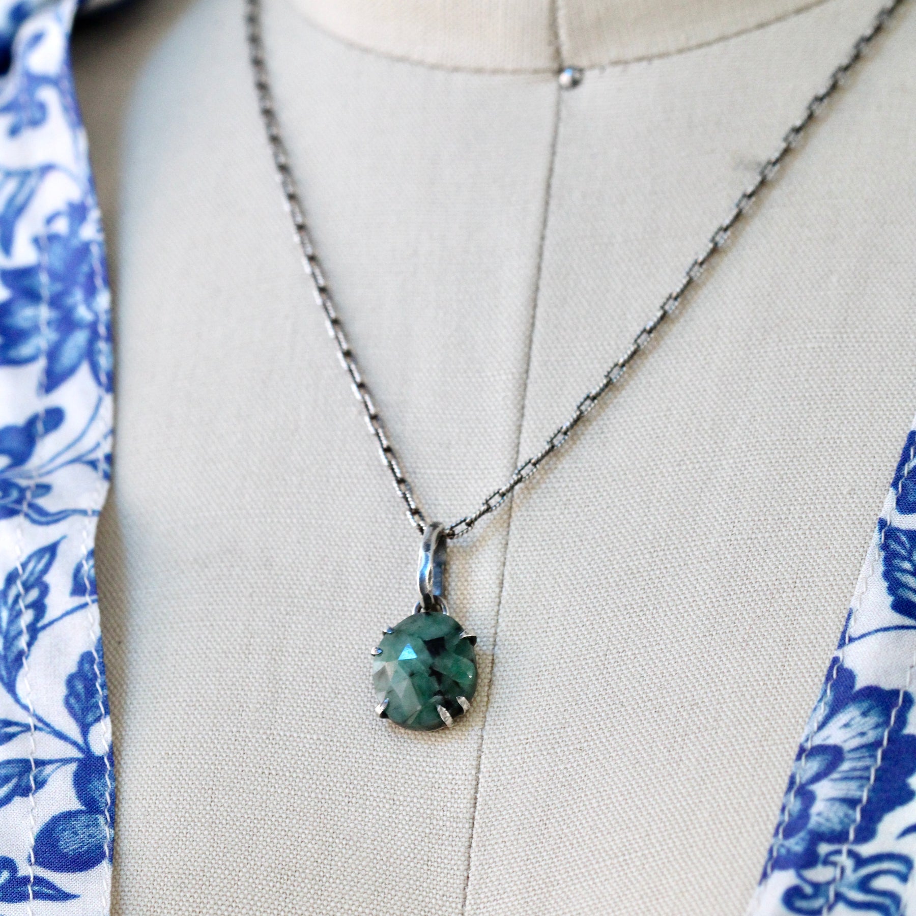 Rose cut Emerald prong set in sterling silver with heart detail