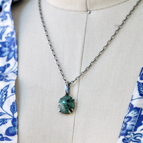 Rose cut Emerald prong set in sterling silver with heart detail